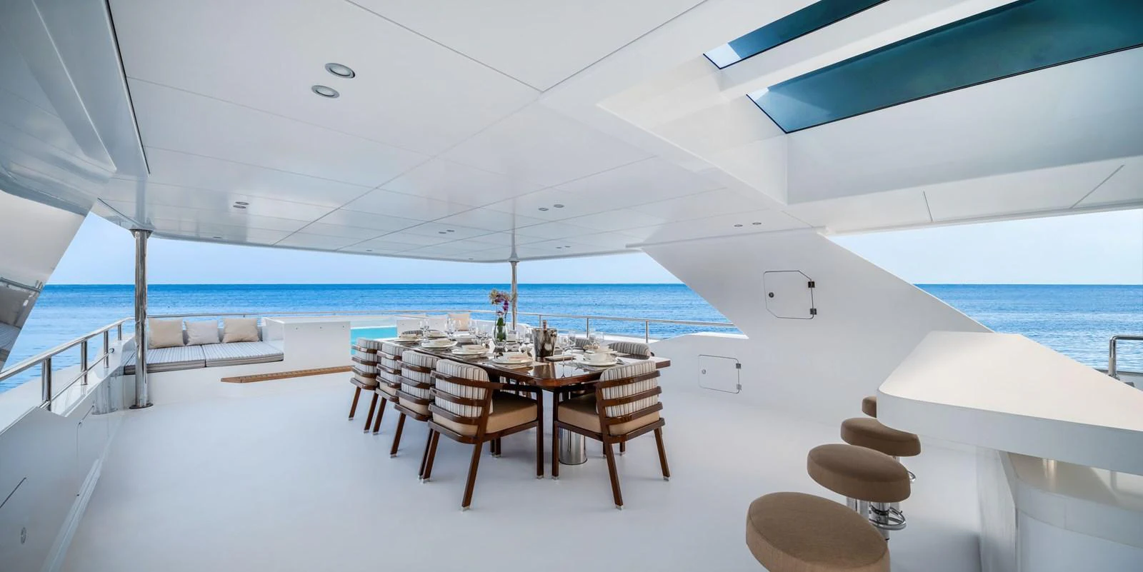 The yacht features a spacious alfresco dining area with a stunning ocean view. aboard E SERIES 125 HARGRAVE SUPERYACHTS Yacht for Sale