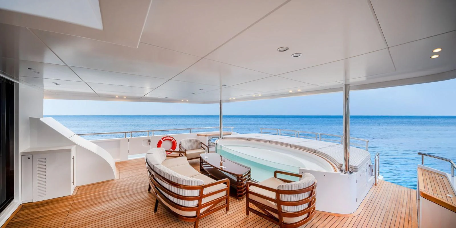 The aft deck features luxurious seating and a jacuzzi with stunning ocean views. aboard E SERIES 125 HARGRAVE SUPERYACHTS Yacht for Sale