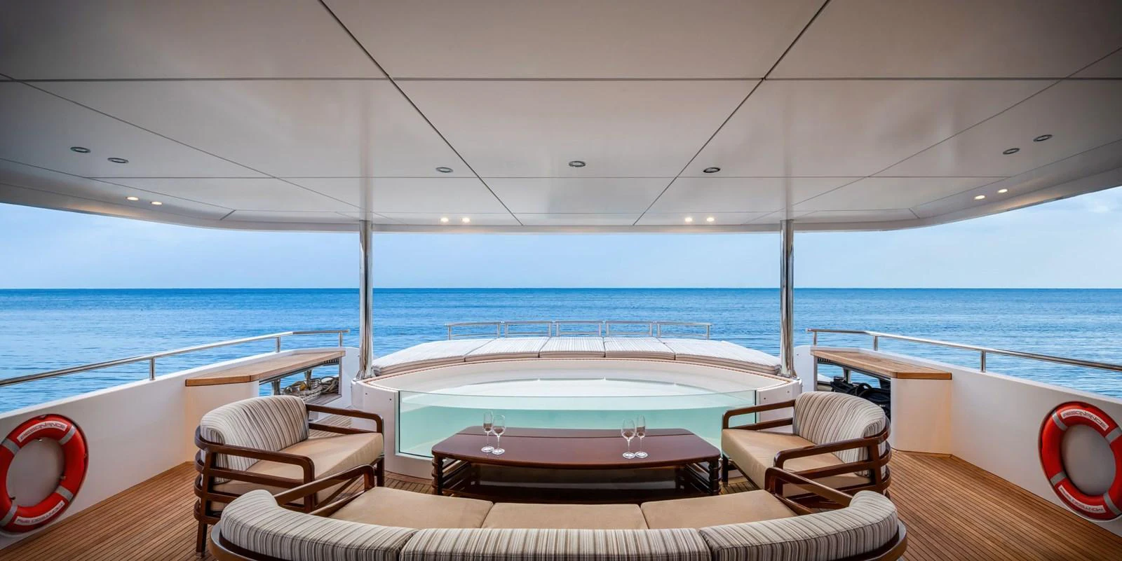 The aft deck offers a luxurious seating area with a stunning ocean view. aboard E SERIES 125 HARGRAVE SUPERYACHTS Yacht for Sale