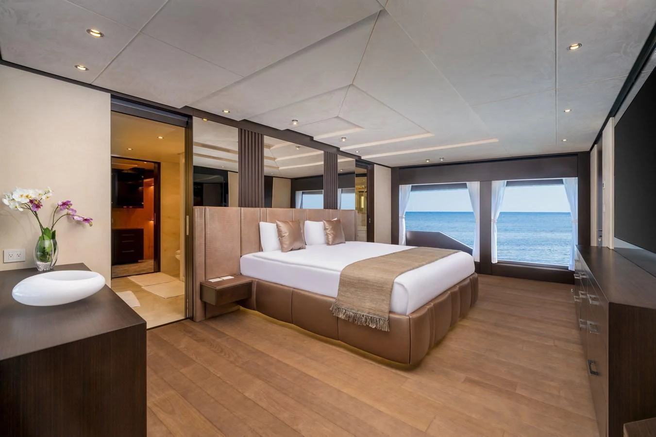 The master stateroom features a spacious layout with a large bed and panoramic ocean views. aboard E SERIES 125 HARGRAVE SUPERYACHTS Yacht for Sale