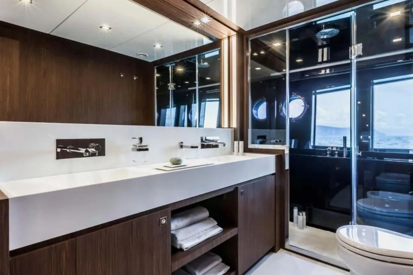 The yacht's bathroom features modern fixtures and a sleek design with ample storage space. aboard ANTIOXIDANT Yacht for Sale