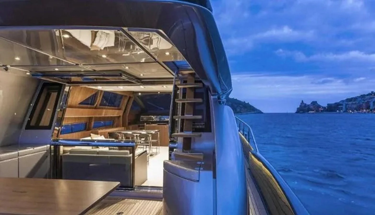 The aft deck of the yacht offers a luxurious and inviting space with a stunning view of the water. aboard ANTIOXIDANT Yacht for Sale