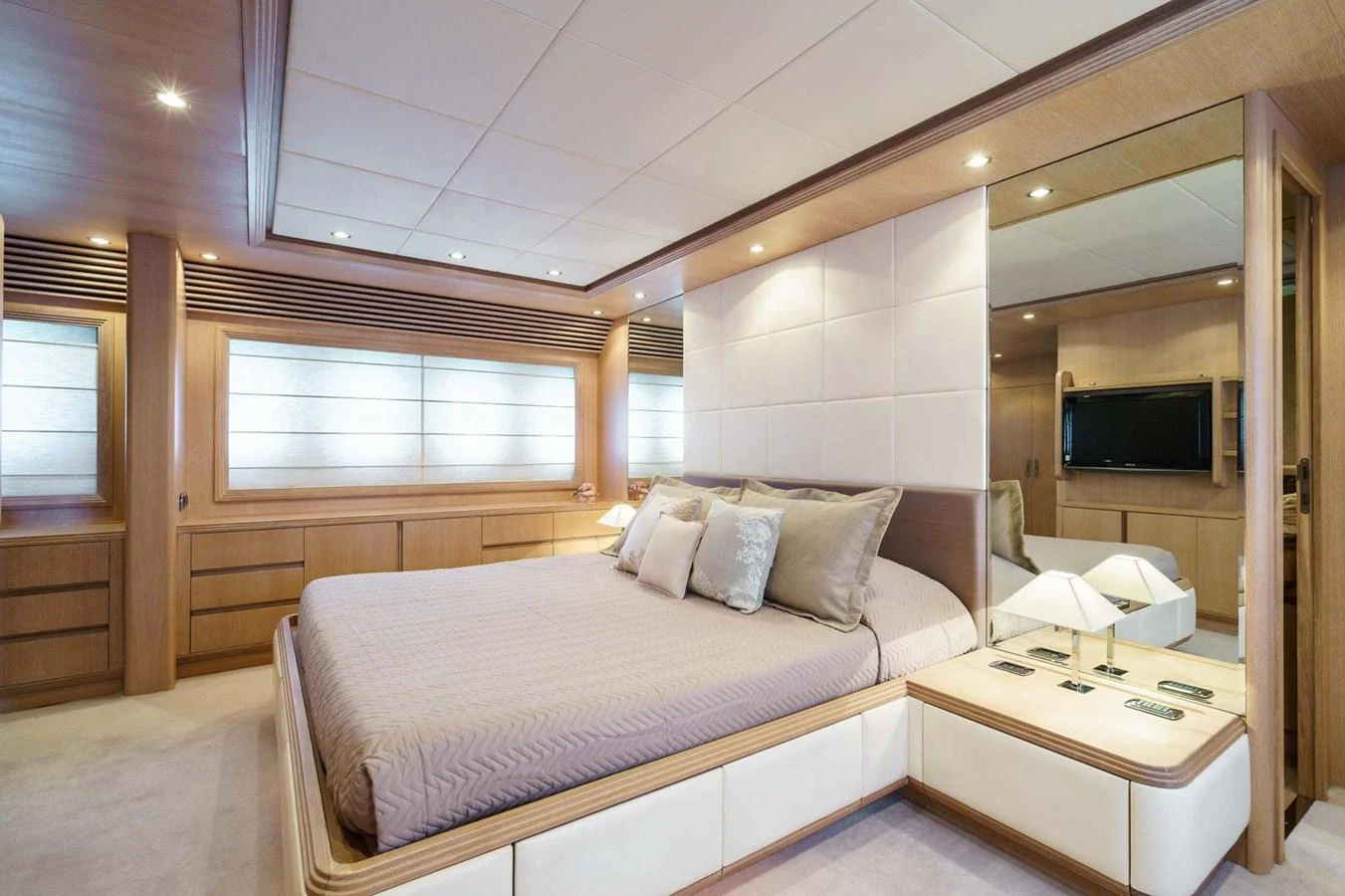 a bedroom with a bed and a tv aboard ALLIE Yacht for Sale