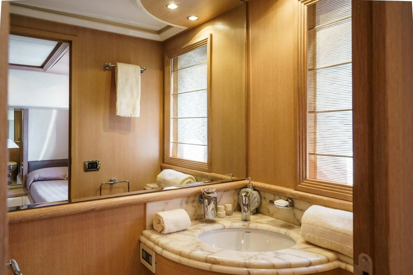 a bathroom with a large mirror aboard ALLIE Yacht for Sale