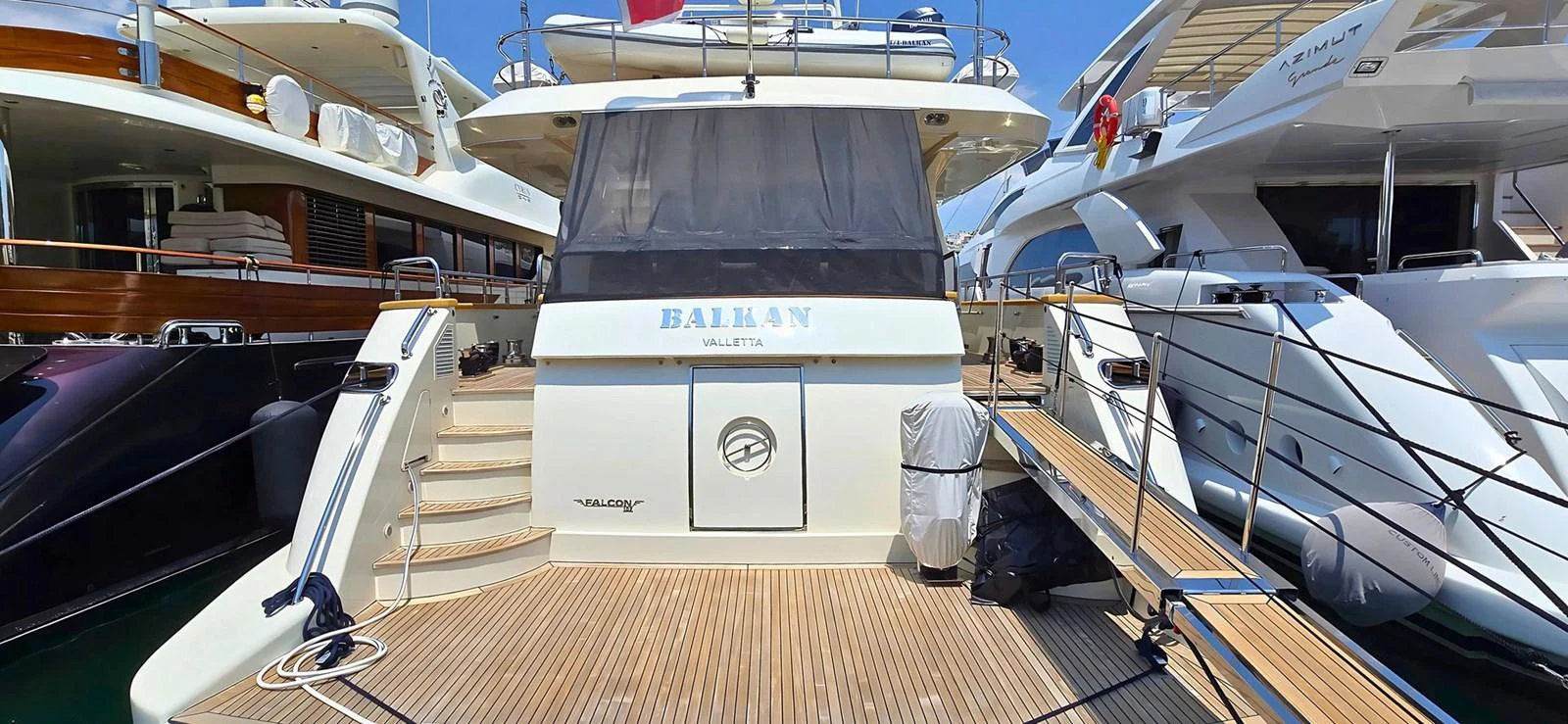 The aft deck of this yacht features a spacious layout with clean lines and modern design. aboard BALKAN Yacht for Sale