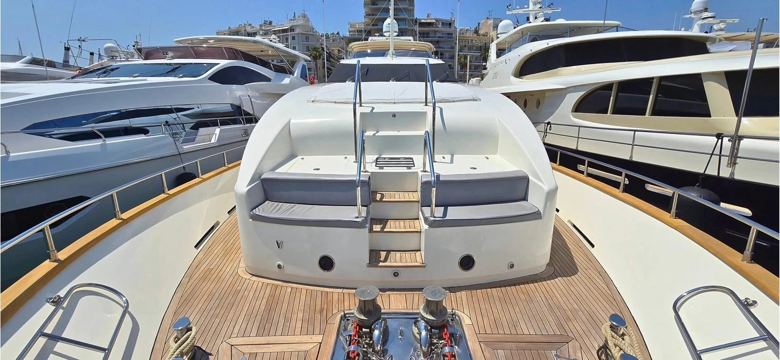 The yacht's foredeck features a spacious sunbathing area with plush seating and a sleek design. aboard BALKAN Yacht for Sale
