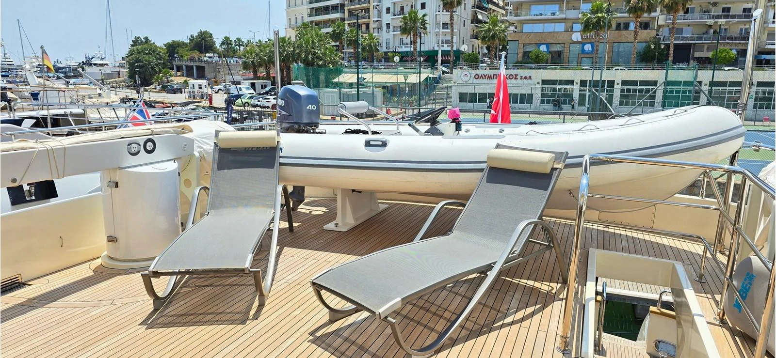 The sundeck features comfortable lounge chairs and a tender, perfect for relaxation and adventure. aboard BALKAN Yacht for Sale