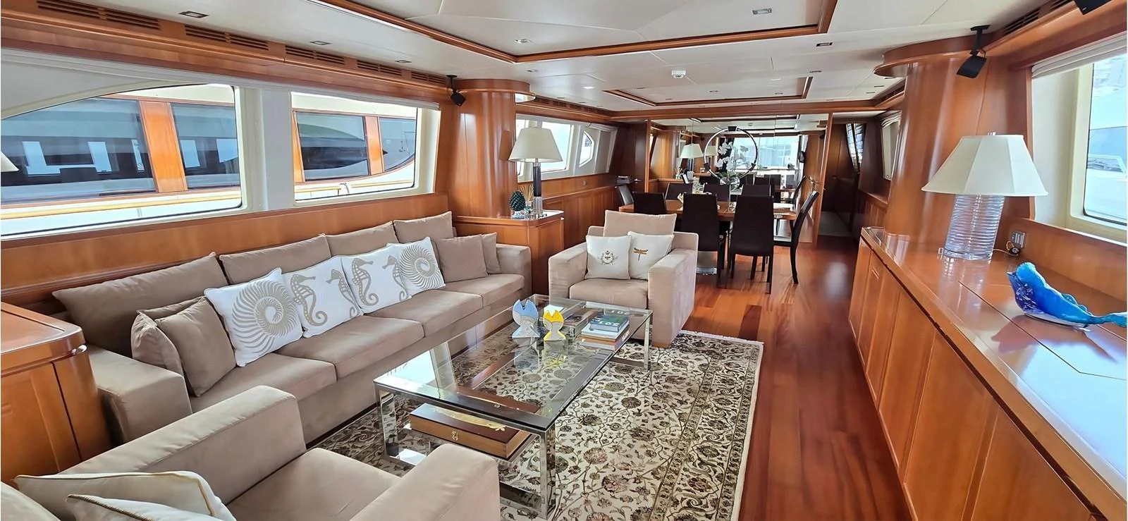 The yacht's salon features plush seating, elegant decor, and ample natural light. aboard BALKAN Yacht for Sale