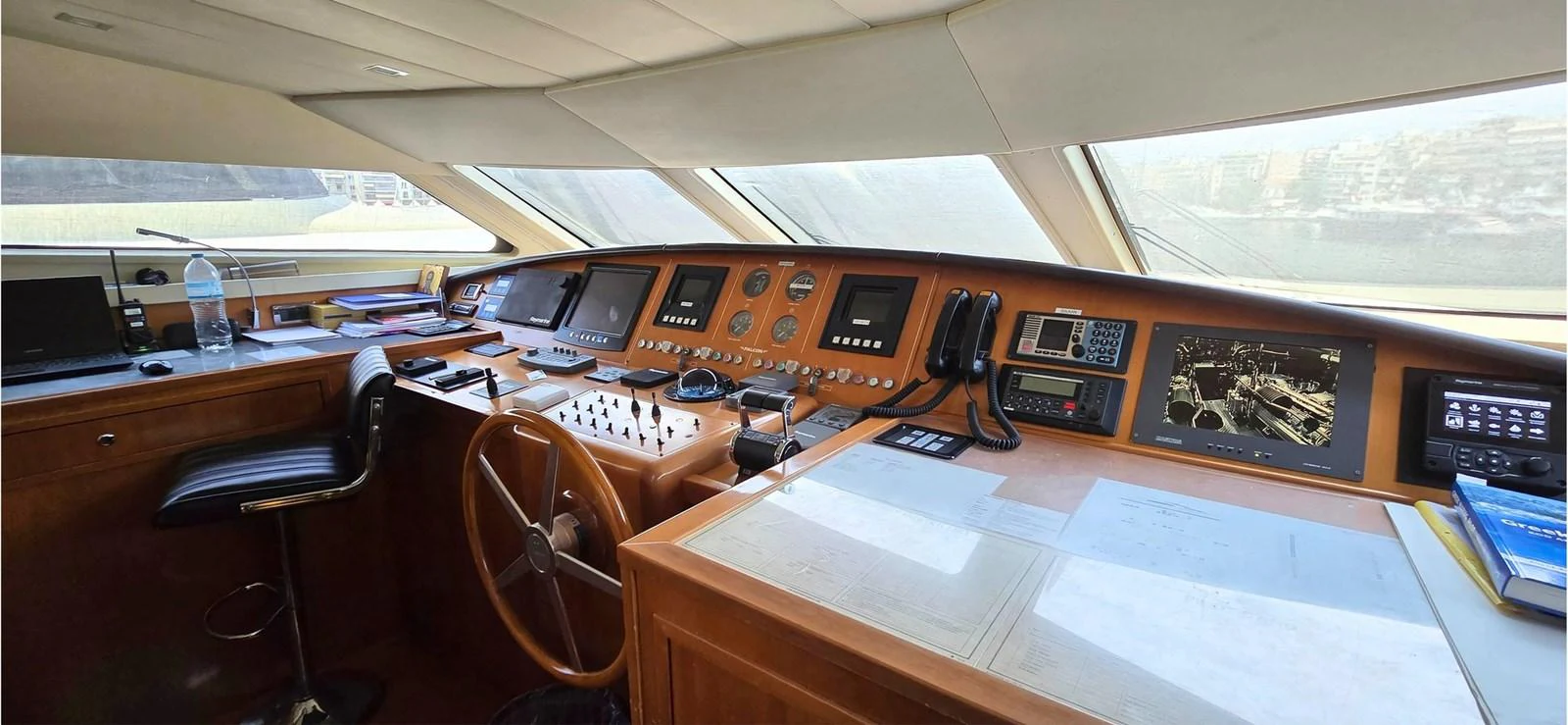 The helm station features advanced navigation equipment and a comfortable captain's chair. aboard BALKAN Yacht for Sale