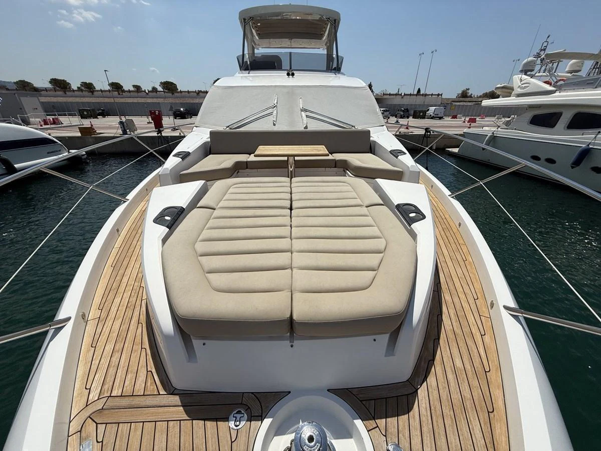 The foredeck features a spacious sunbathing area with plush cushions and elegant teak decking. aboard "BISHWISH" Yacht for Sale