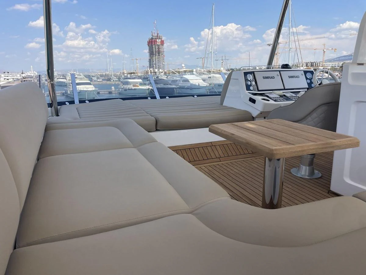 The flybridge offers comfortable seating with a view of the marina. aboard "BISHWISH" Yacht for Sale