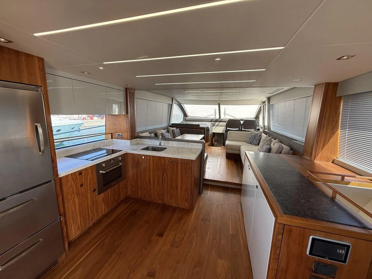 The yacht's galley features modern appliances and a spacious layout with ample natural light. aboard "BISHWISH" Yacht for Sale