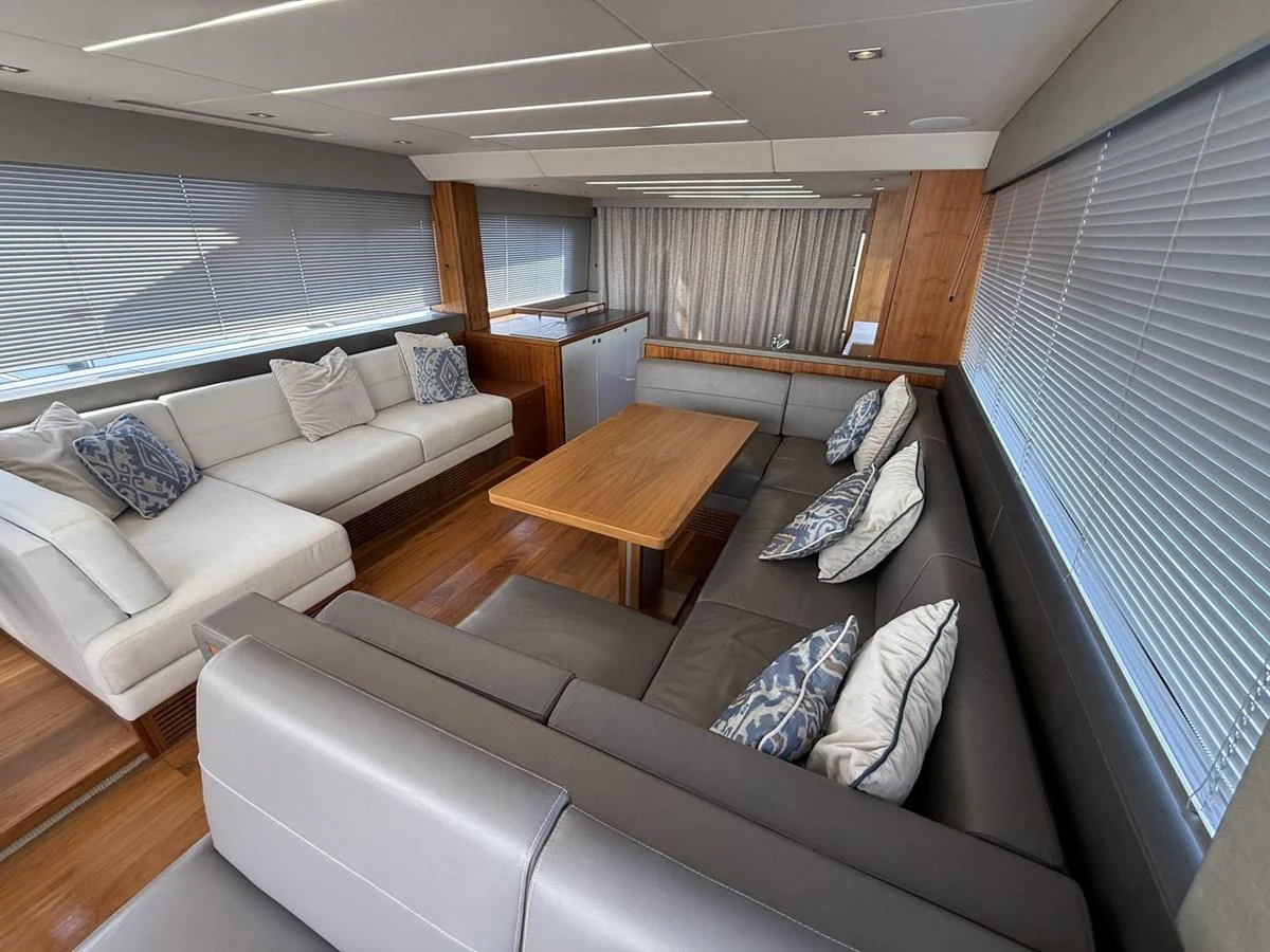 The salon features a spacious seating area with modern furnishings and ample natural light. aboard "BISHWISH" Yacht for Sale