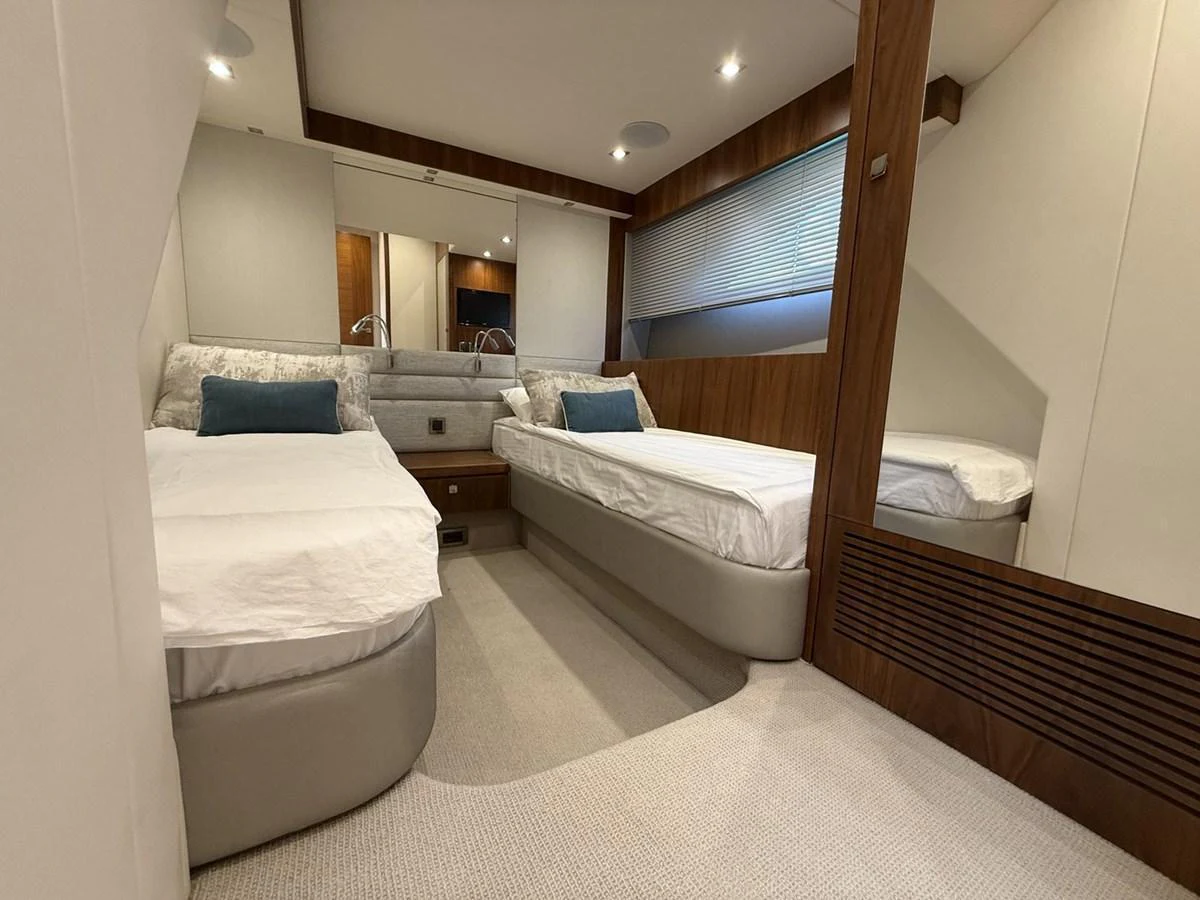 The guest stateroom features twin beds and elegant wood accents. aboard "BISHWISH" Yacht for Sale