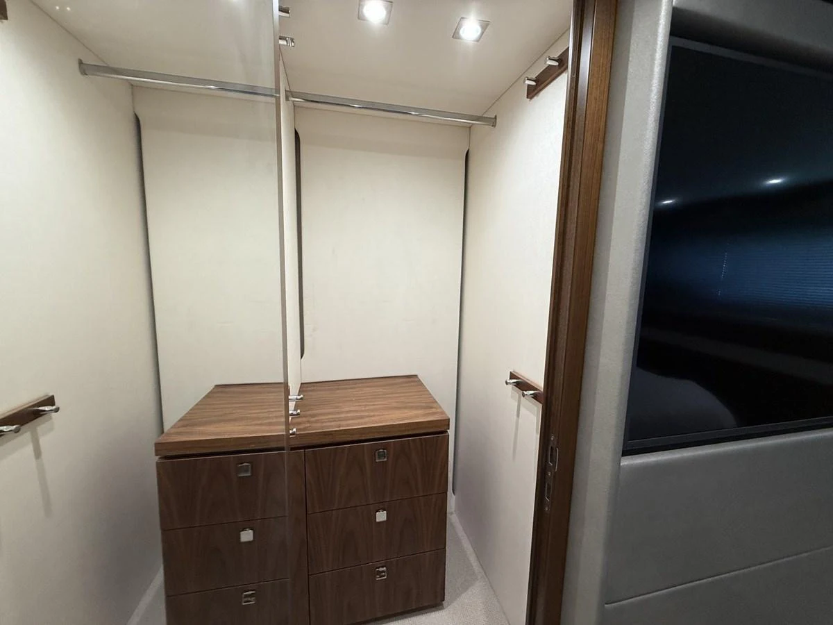 The image showcases a well-appointed interior space with ample storage and modern finishes. aboard "BISHWISH" Yacht for Sale