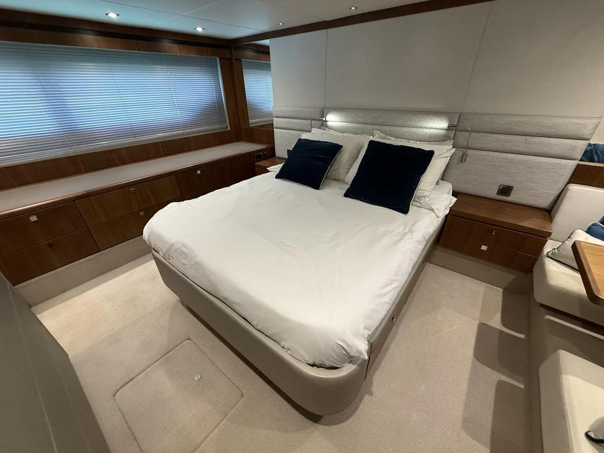 The stateroom features a plush bed with elegant bedding and ample storage space, creating a serene and luxurious retreat. aboard "BISHWISH" Yacht for Sale