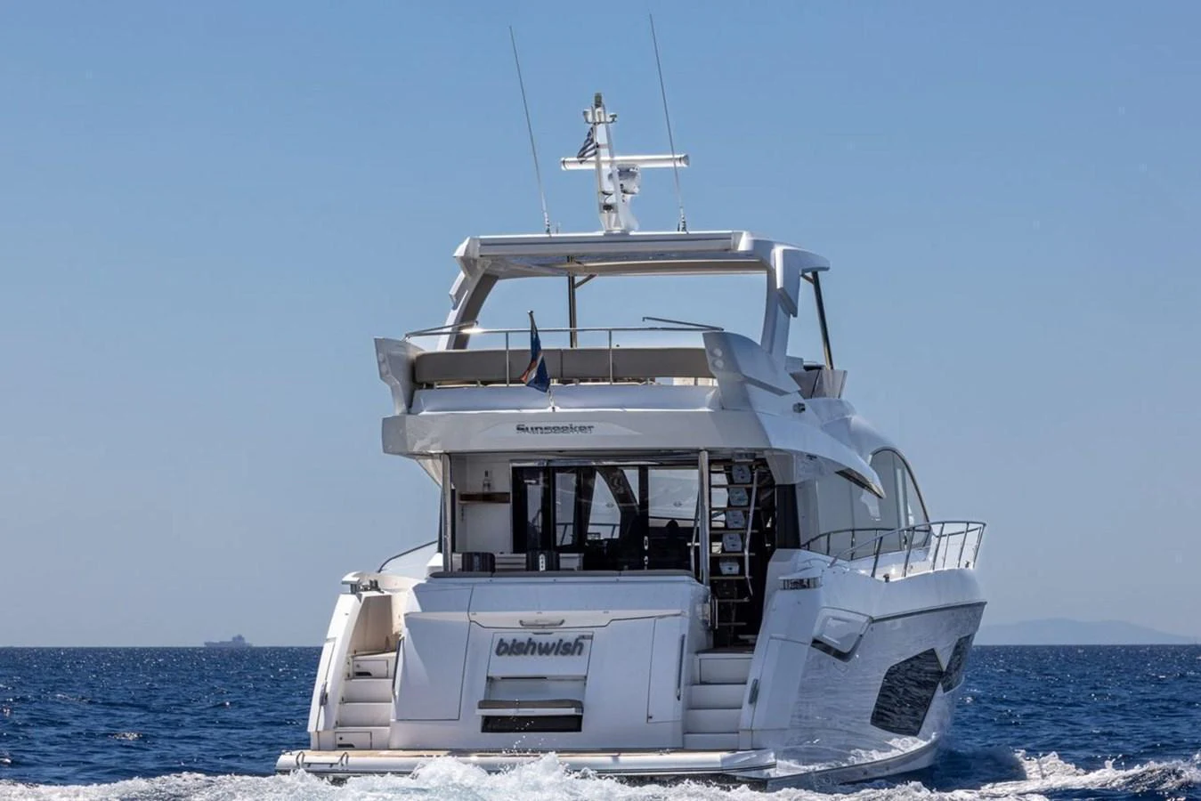 A luxurious yacht cruising on the open sea, showcasing its sleek design and spacious deck. aboard "BISHWISH" Yacht for Sale