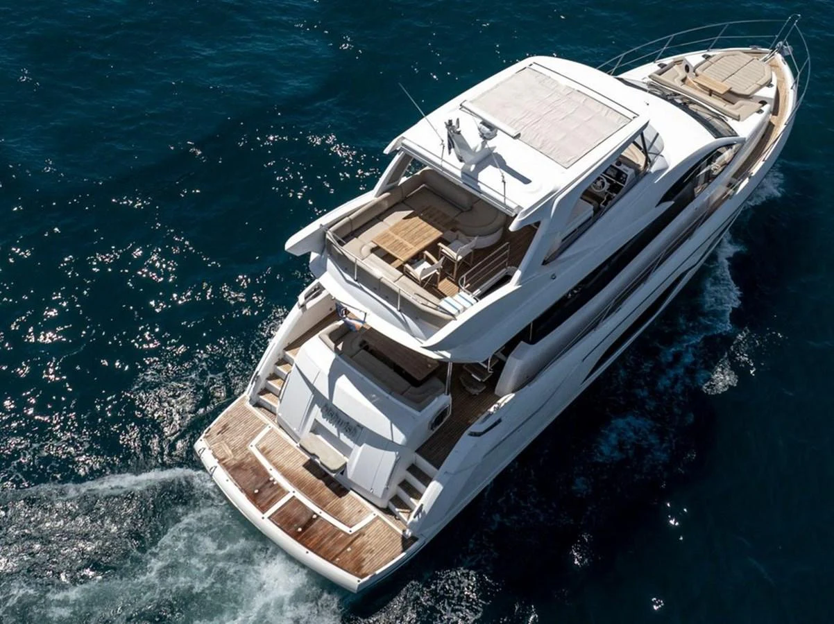 A luxurious yacht cruising on the open sea with a spacious aft deck and sleek design. aboard "BISHWISH" Yacht for Sale