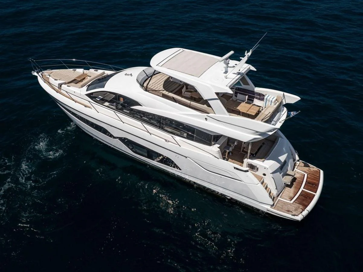 A sleek, modern yacht cruising on deep blue waters, showcasing its elegant design and spacious decks. aboard "BISHWISH" Yacht for Sale