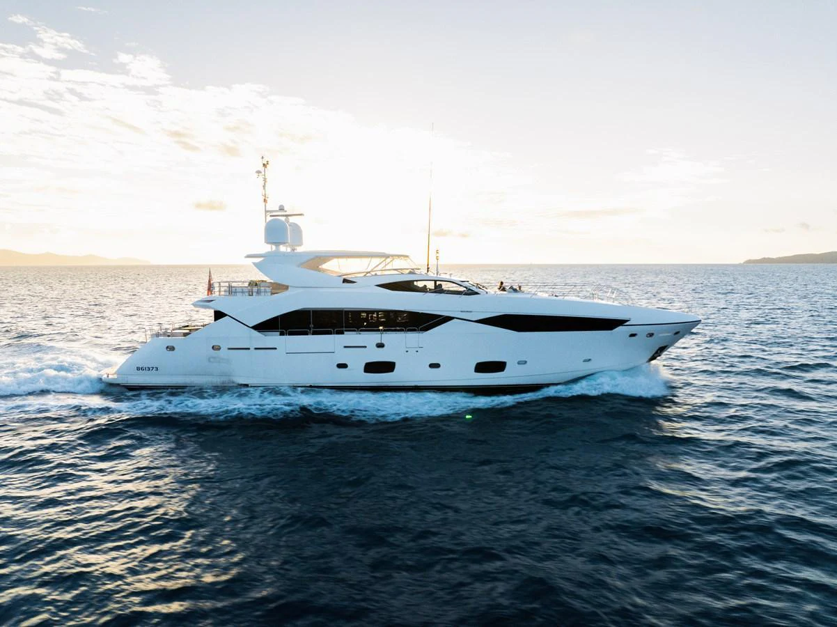 A sleek and modern yacht cruises gracefully on the open sea under a clear sky. aboard RASCAL Yacht for Sale