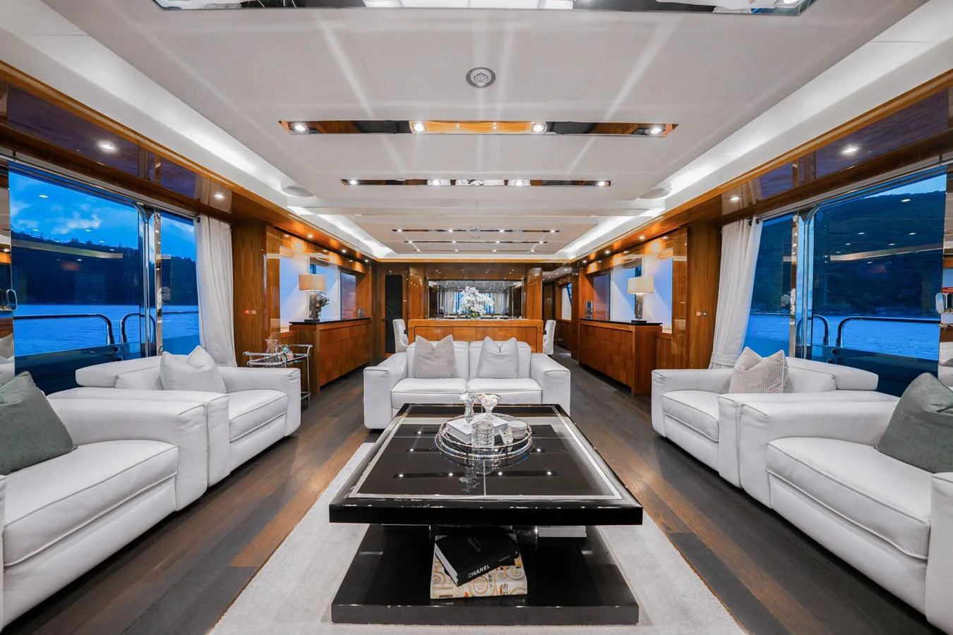 The yacht's salon features luxurious seating with a sophisticated and modern design. aboard RASCAL Yacht for Sale