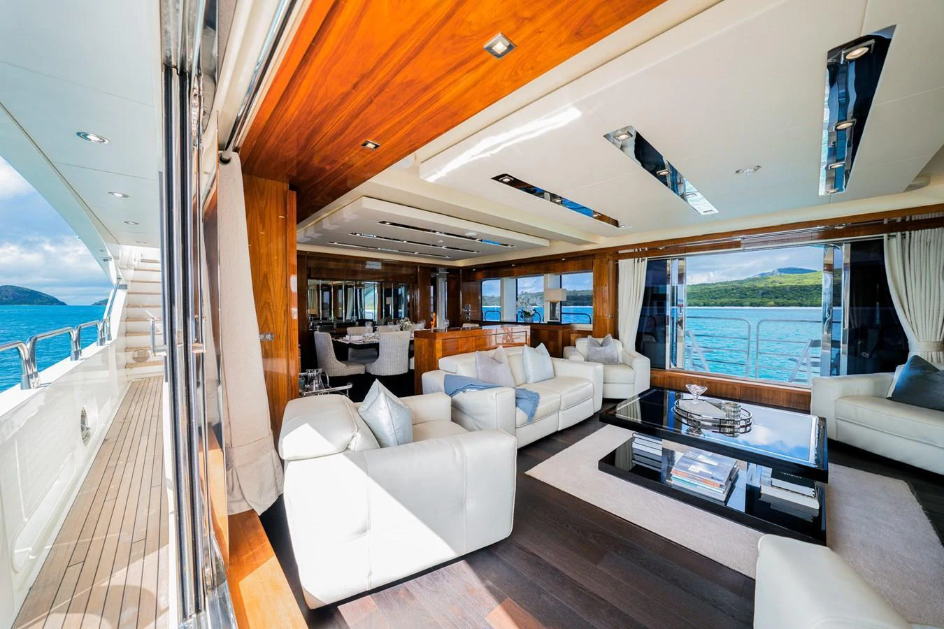 The spacious salon features luxurious seating and panoramic views. aboard RASCAL Yacht for Sale