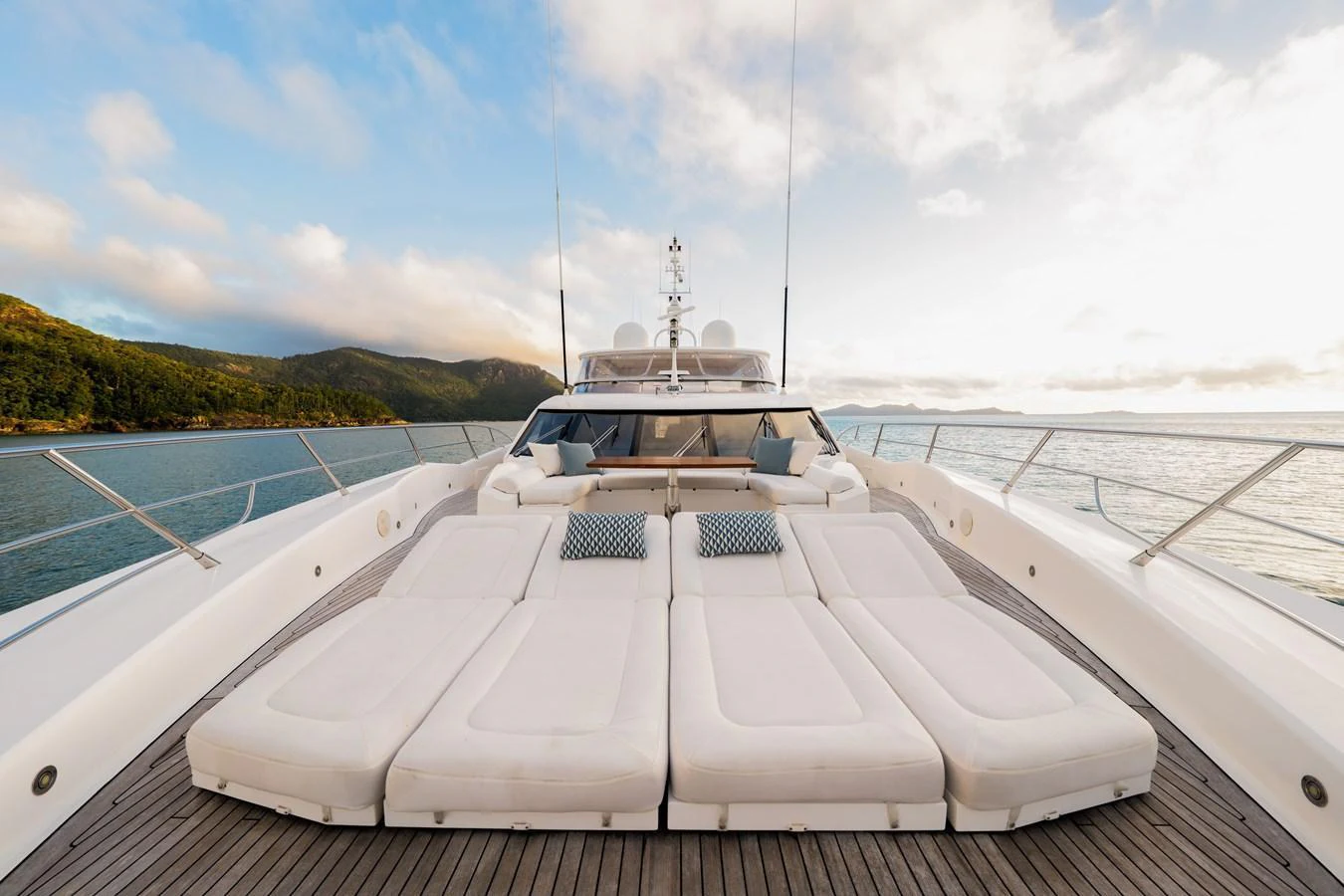 The yacht's foredeck features luxurious sun pads with scenic views of the surrounding waters. aboard RASCAL Yacht for Sale