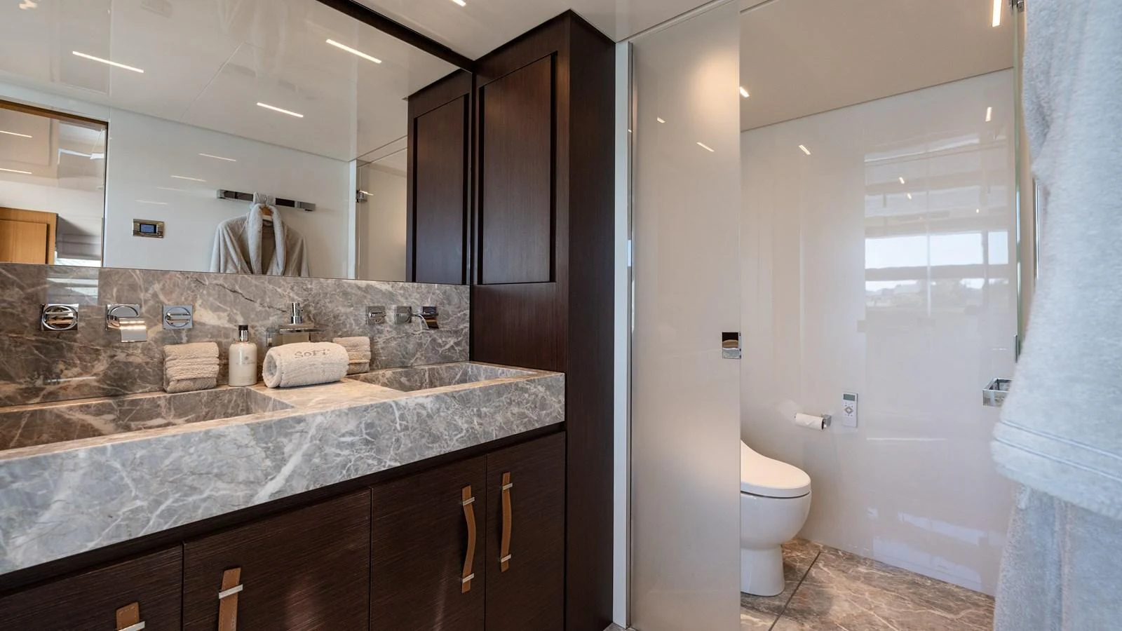 a bathroom with a countertop sink and a mirror aboard SANLORENZO SL120/778 Yacht for Sale