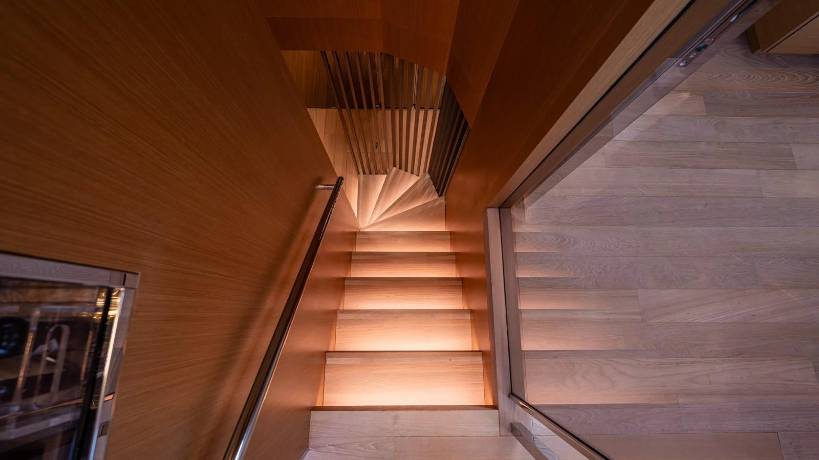 a wooden staircase with a railing aboard SANLORENZO SL120/778 Yacht for Sale