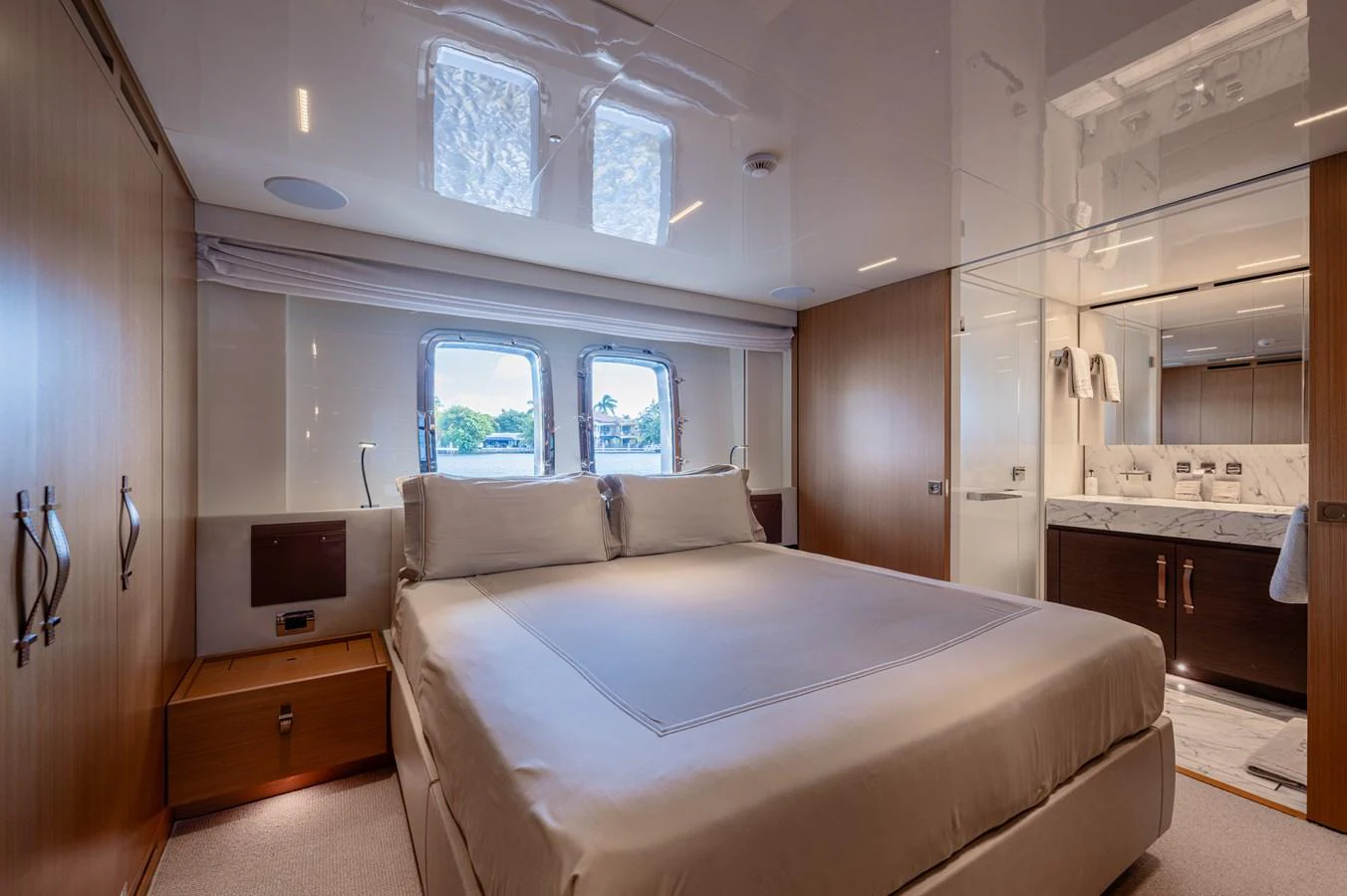 a room with a bed and a window aboard SANLORENZO SL120/778 Yacht for Sale