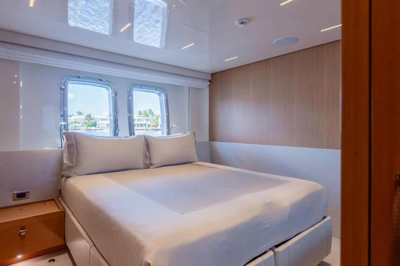 a room with a bed and a window aboard SANLORENZO SL120/778 Yacht for Sale