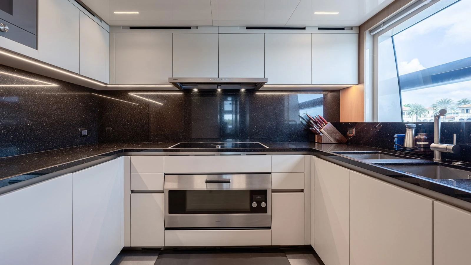 a kitchen with white cabinets aboard SANLORENZO SL120/778 Yacht for Sale