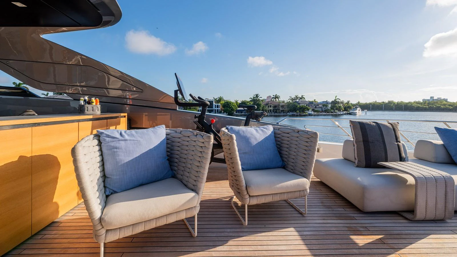 a lounge area with chairs and a large body of water in the background aboard SANLORENZO SL120/778 Yacht for Sale