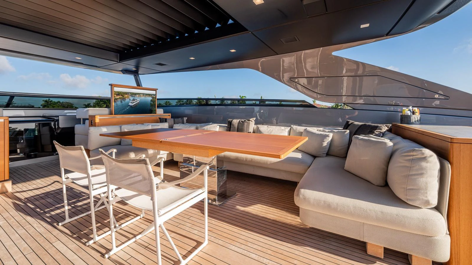 a table and chairs on a deck aboard SANLORENZO SL120/778 Yacht for Sale
