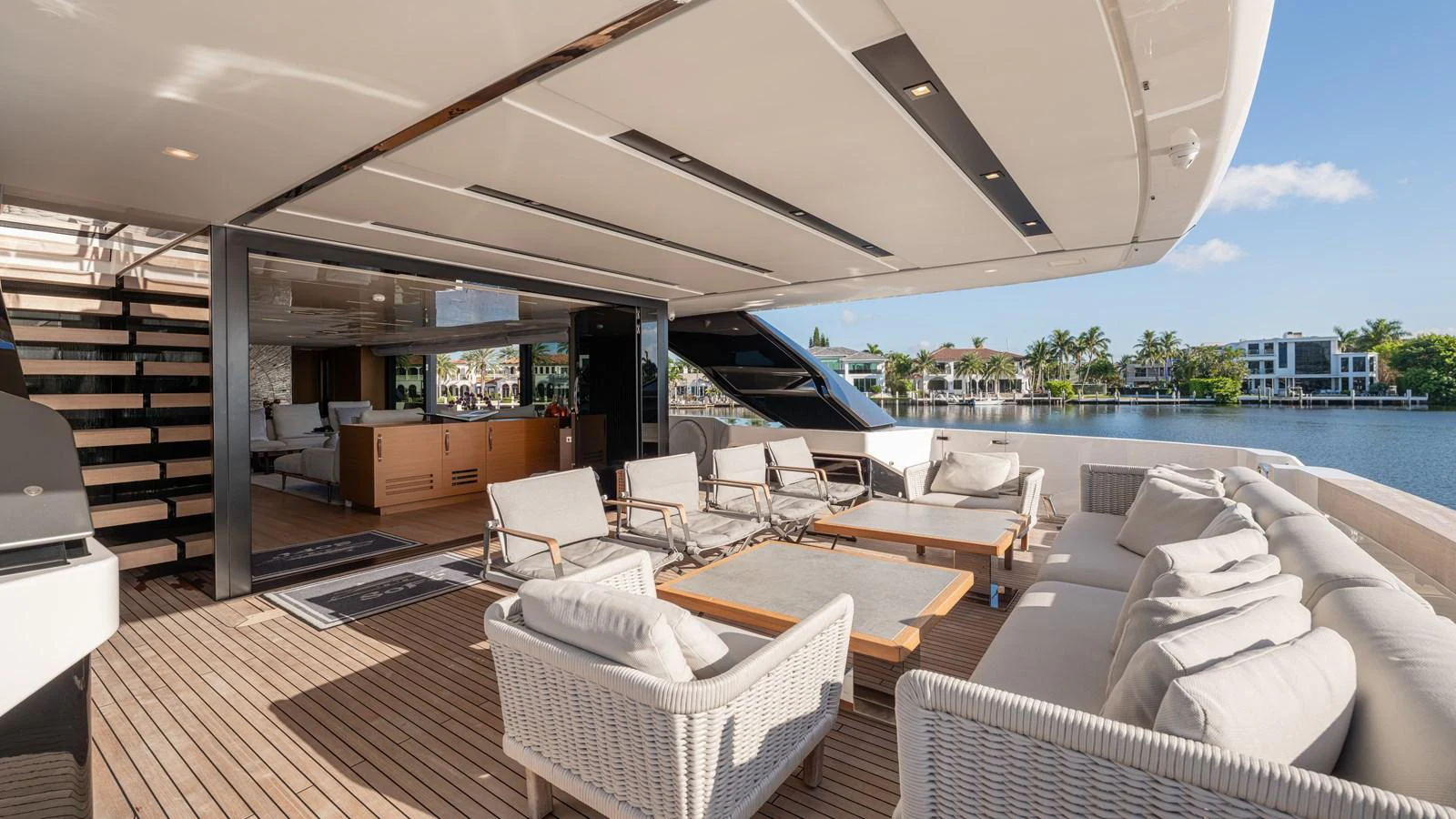 a large living room with a large balcony overlooking a body of water aboard SANLORENZO SL120/778 Yacht for Sale