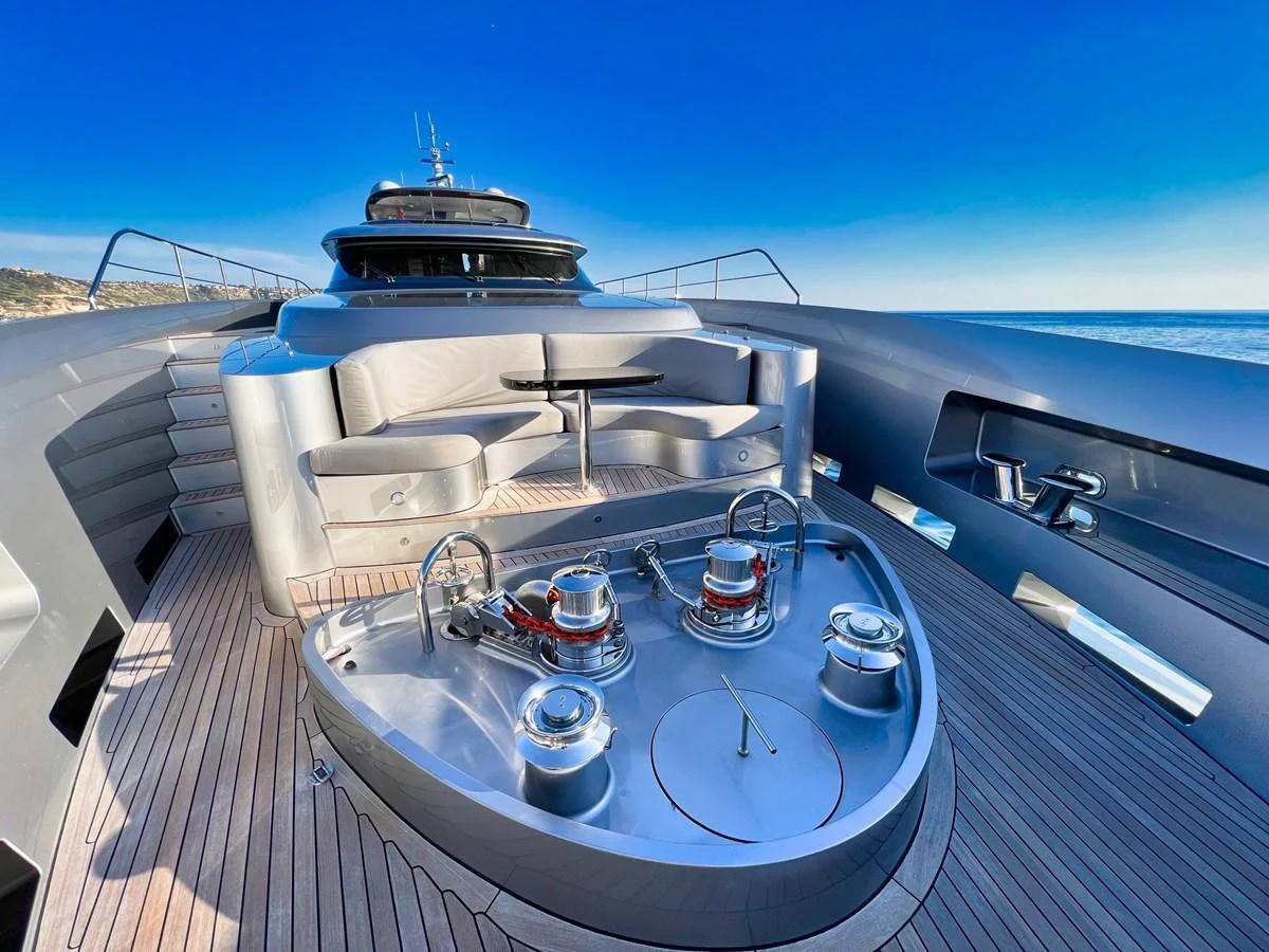 The foredeck features a luxurious seating area with a sleek, modern design and stunning ocean views. aboard SMOOTH OPERATOR Yacht for Sale
