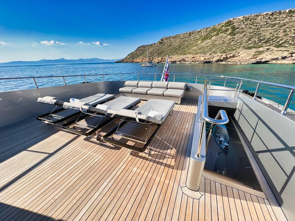The sundeck offers luxurious sun loungers and a stunning view of the surrounding waters. aboard SMOOTH OPERATOR Yacht for Sale