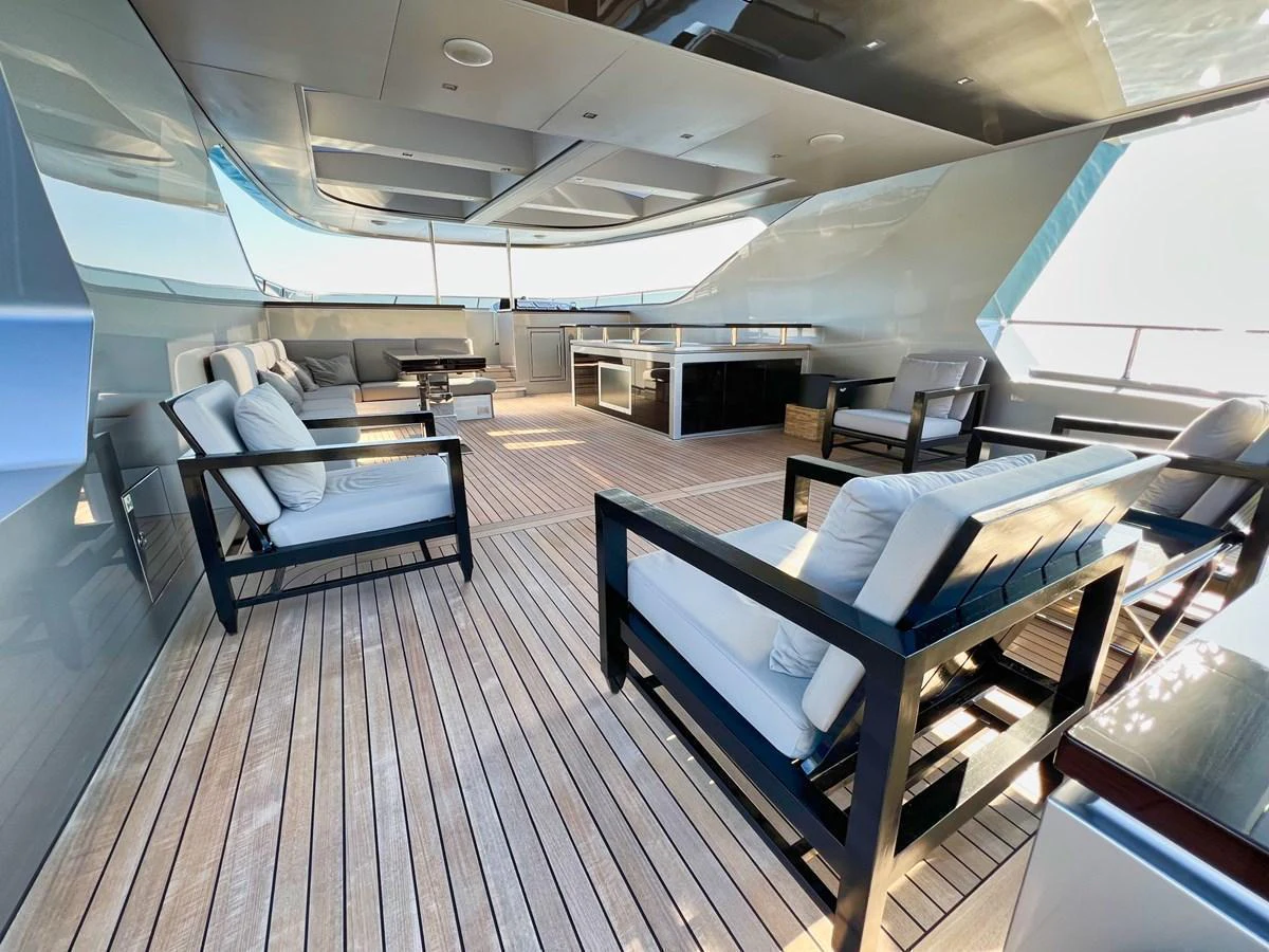 The spacious aft deck features comfortable seating and a sleek, modern design. aboard SMOOTH OPERATOR Yacht for Sale