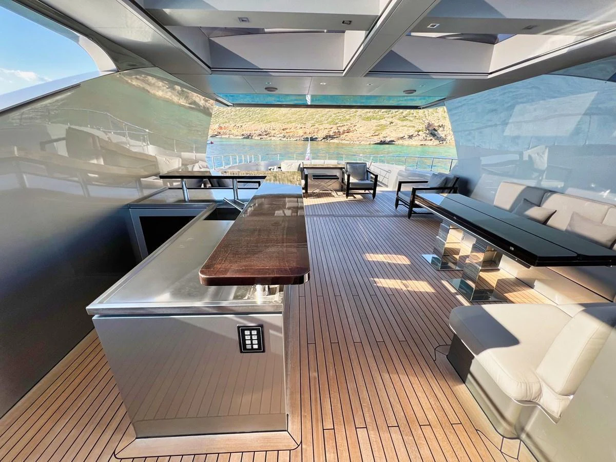 The aft deck offers a spacious and stylish area for relaxation and dining with stunning views. aboard SMOOTH OPERATOR Yacht for Sale