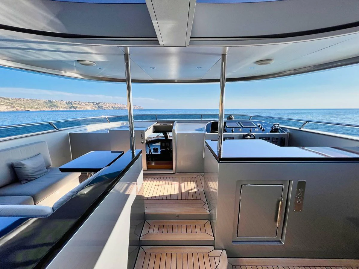 The helm area offers a panoramic view of the sea, complemented by sleek, modern design elements. aboard SMOOTH OPERATOR Yacht for Sale