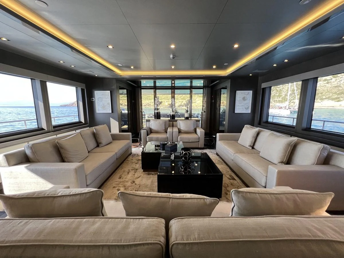 The salon features luxurious seating with panoramic views through large windows. aboard SMOOTH OPERATOR Yacht for Sale