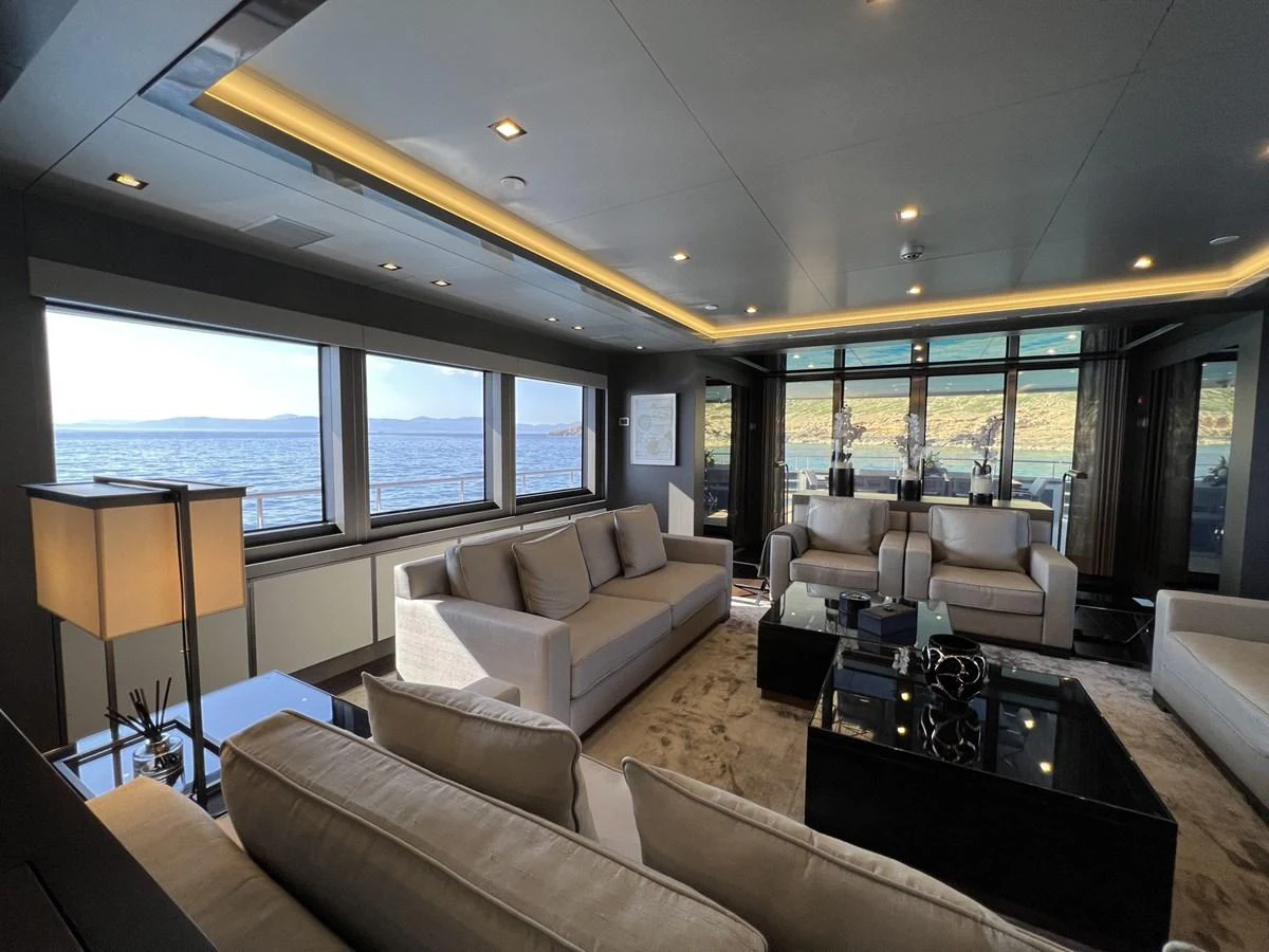 The yacht's salon offers a spacious and elegant seating area with panoramic views of the sea. aboard SMOOTH OPERATOR Yacht for Sale