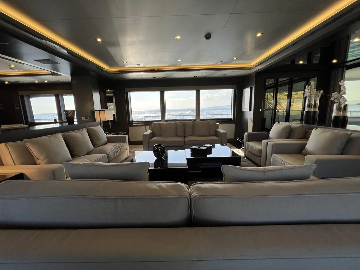 The salon offers a spacious and luxurious seating area with panoramic views. aboard SMOOTH OPERATOR Yacht for Sale