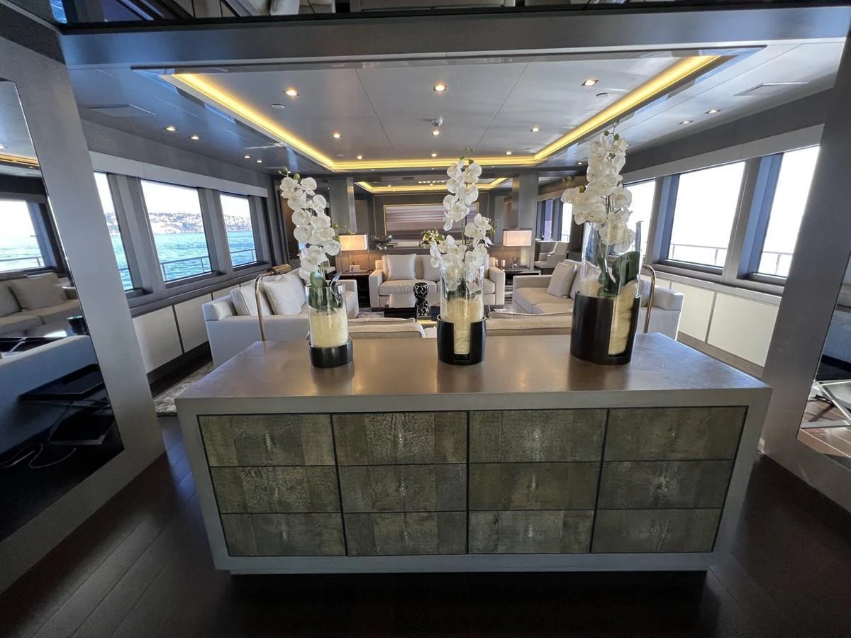 The salon features elegant decor with ample seating and large windows offering stunning views. aboard SMOOTH OPERATOR Yacht for Sale