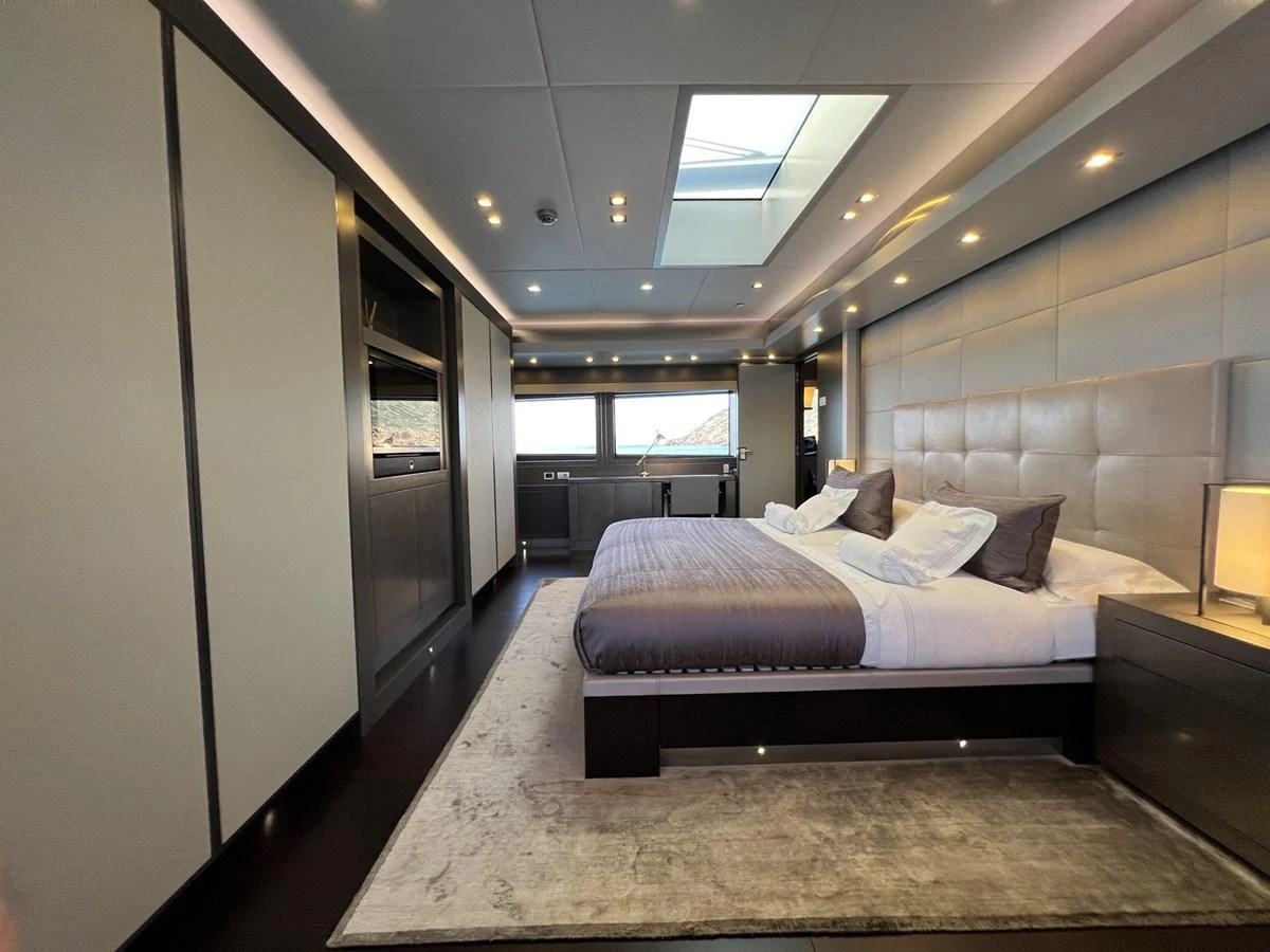 The master stateroom exudes luxury with its spacious layout and elegant design. aboard SMOOTH OPERATOR Yacht for Sale