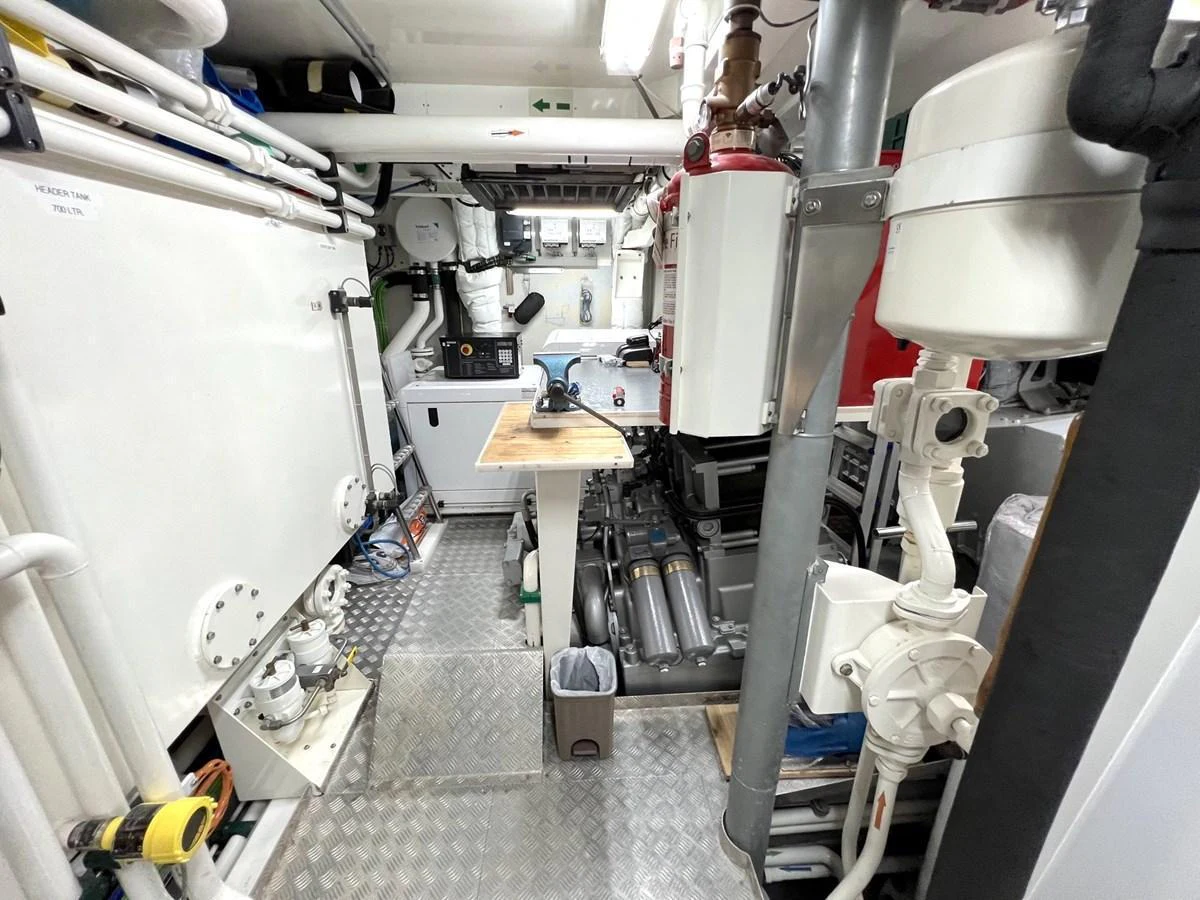 The image showcases the yacht's well-organized engine room with various mechanical components and systems. aboard SMOOTH OPERATOR Yacht for Sale