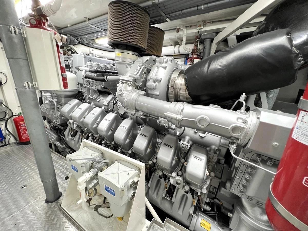The image showcases the powerful and meticulously maintained engine room of the yacht. aboard SMOOTH OPERATOR Yacht for Sale