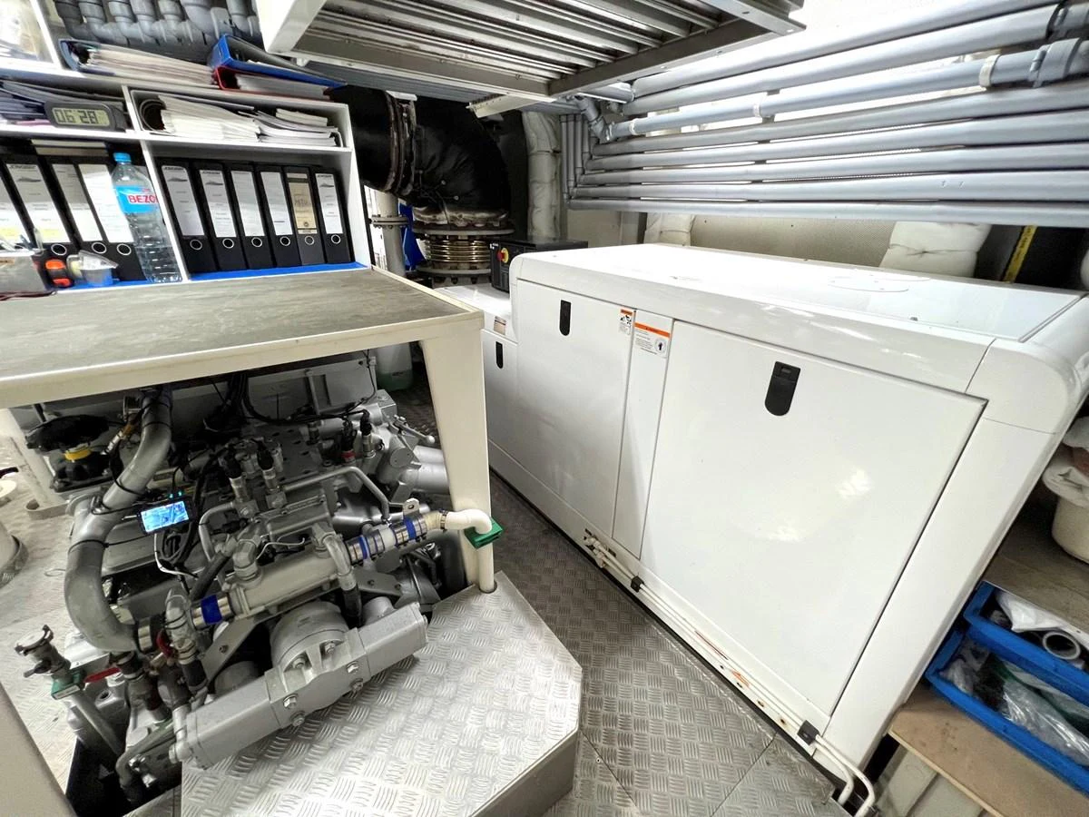 The image showcases the well-organized engine room with essential machinery and equipment. aboard SMOOTH OPERATOR Yacht for Sale