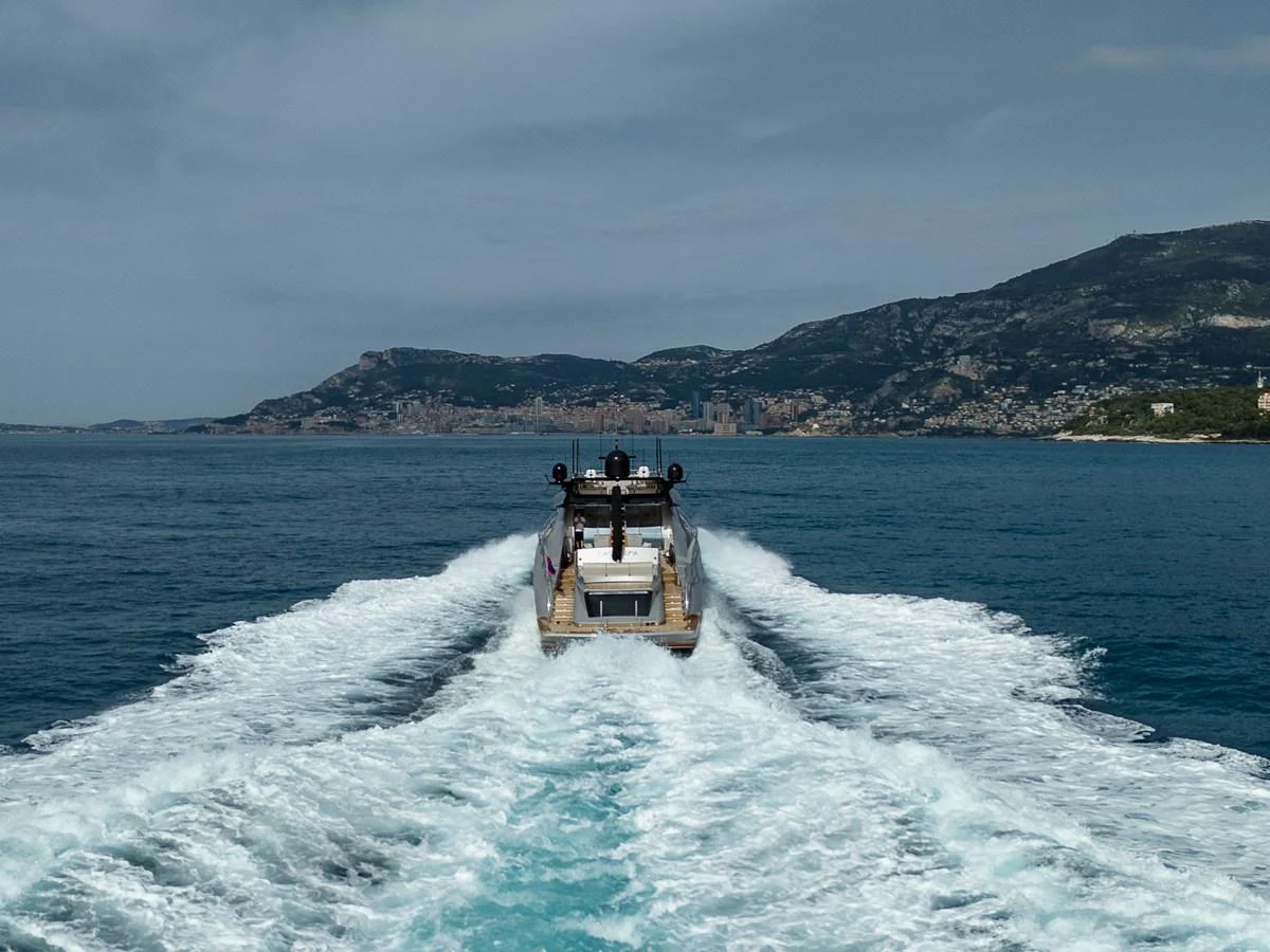 The yacht cruises through open waters, leaving a trail of white wake behind. aboard BAGHEERA Yacht for Sale