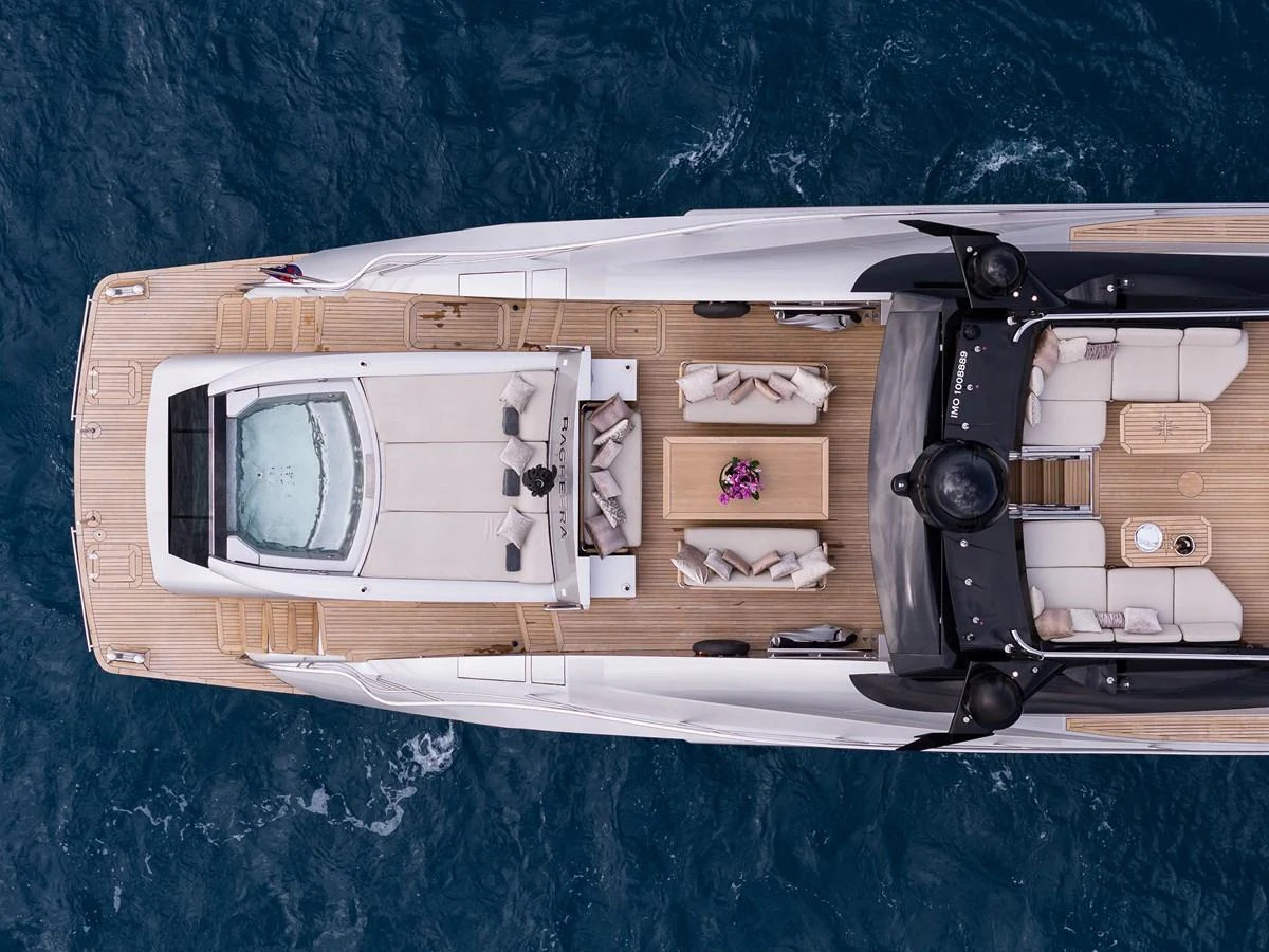 An aerial view of the yacht's sundeck showcasing a luxurious lounging area and a jacuzzi. aboard BAGHEERA Yacht for Sale